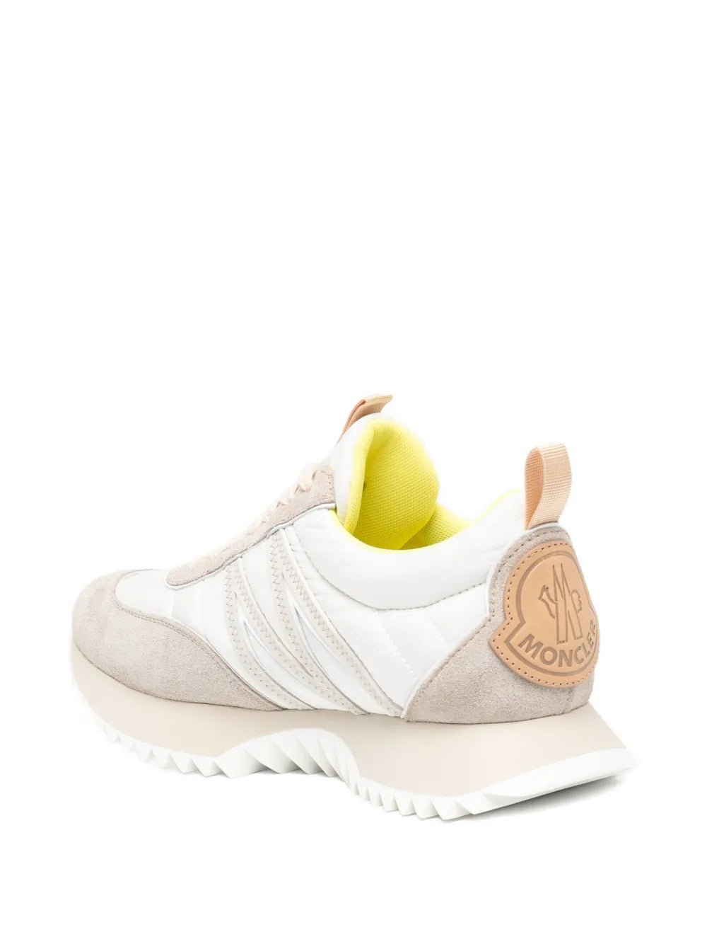 Beige and white low-top lace trainers with rear logo patch and chunky ridged sole