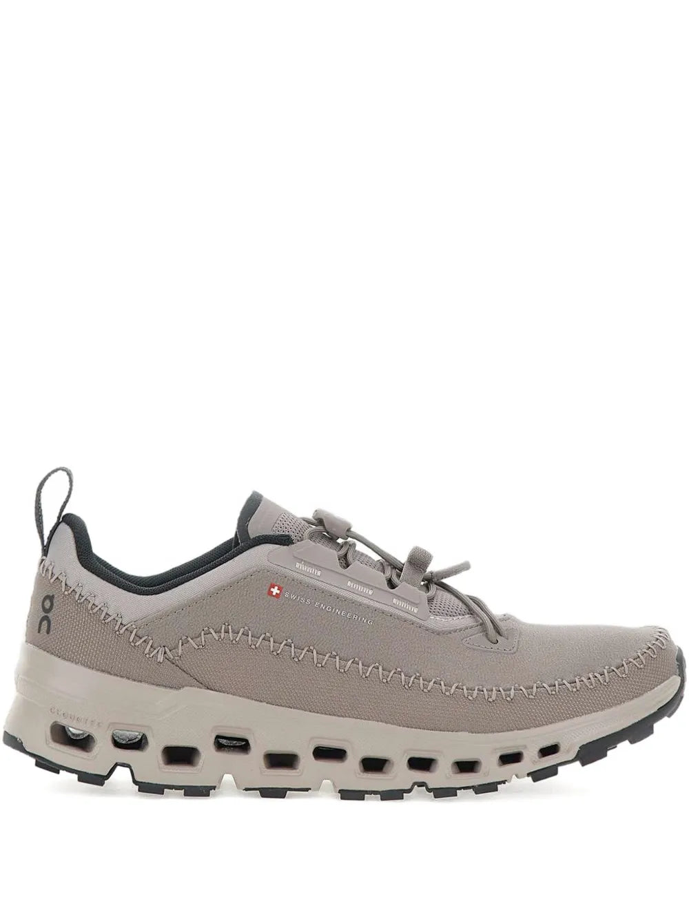 Grey lace-up running shoe with cushioned outsole and cloud-style pods