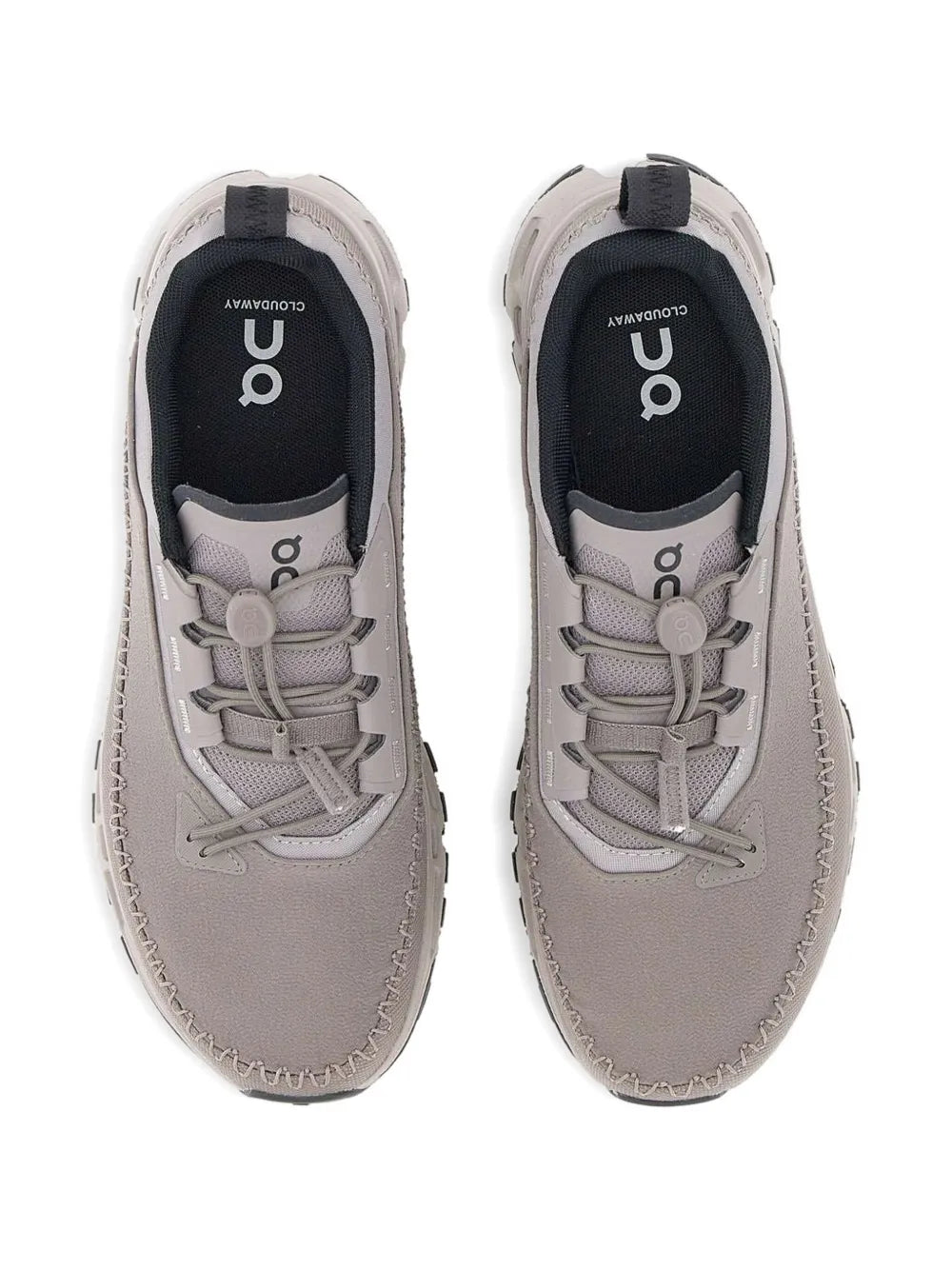 Grey sneakers front view with fabric laces and On logo on inner tongue