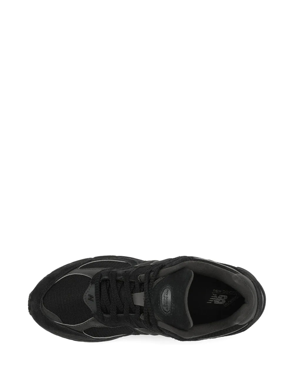 Black New Balance 2002R sneaker, lace-up, visible tread outsole and heel tab