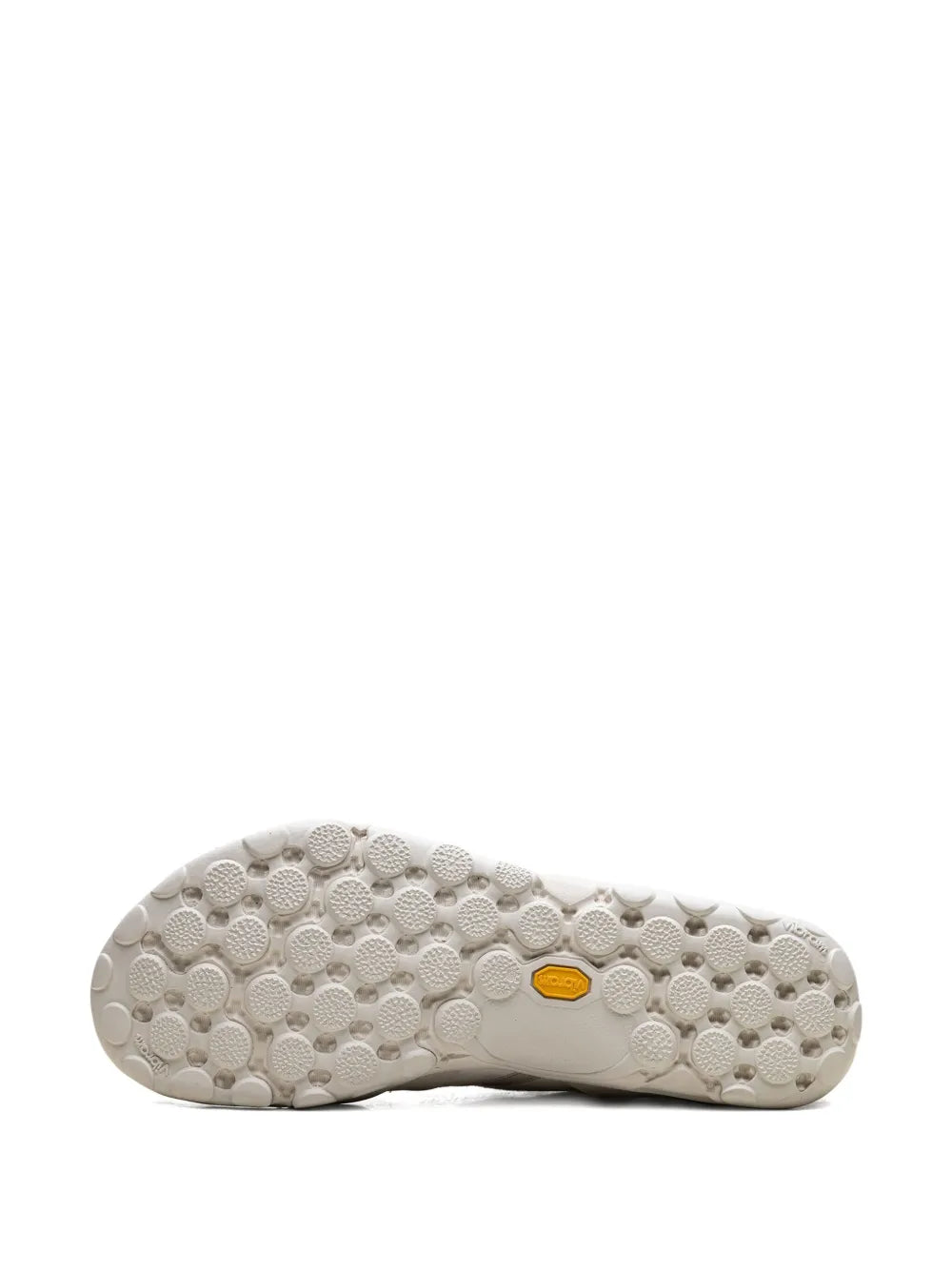 Off-white sneaker outsole with grippy rubber tread and yellow traction insert