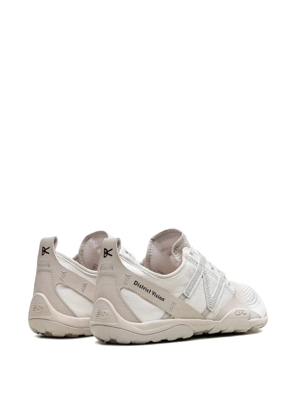 Off-white New Balance sneakers with heel pull tab and District Vision logo