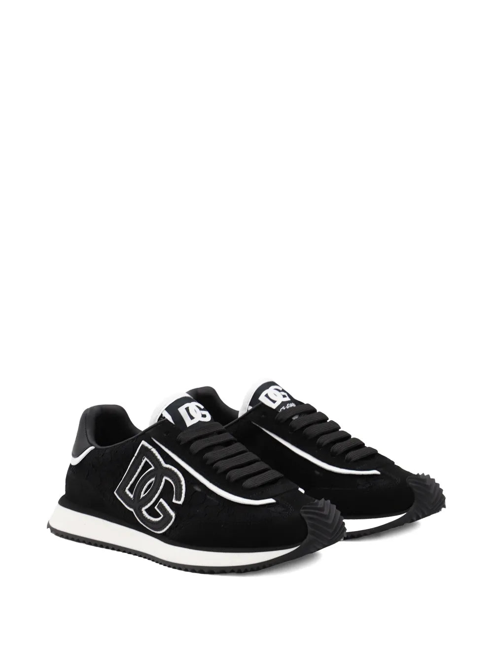 Black sneakers with white logo patch, side view, lace-up with white sole