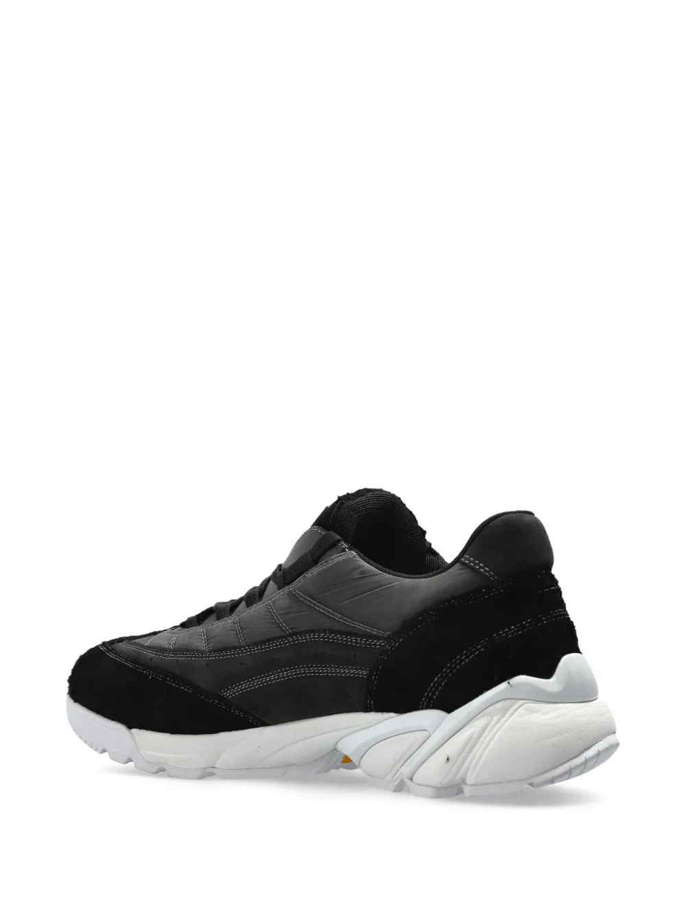Black and gray panelled sneakers with strap-like detail and white sole