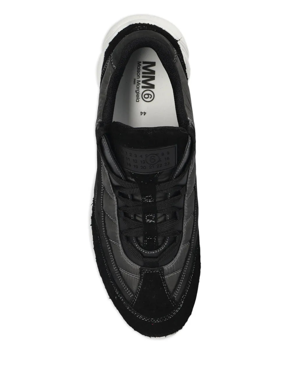 Black panelled sneakers showing lace-up tongue and logo-printed insole