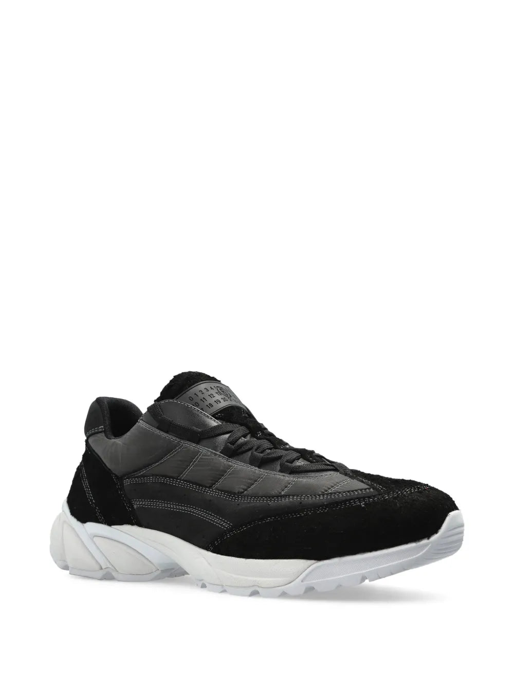 Black panelled sneakers with lace-up front and sculpted white midsole