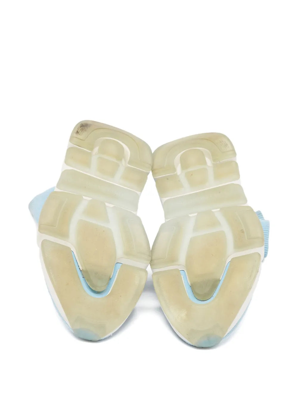 Light blue knit sock sneaker soles underside, cream-toned outsole panels
