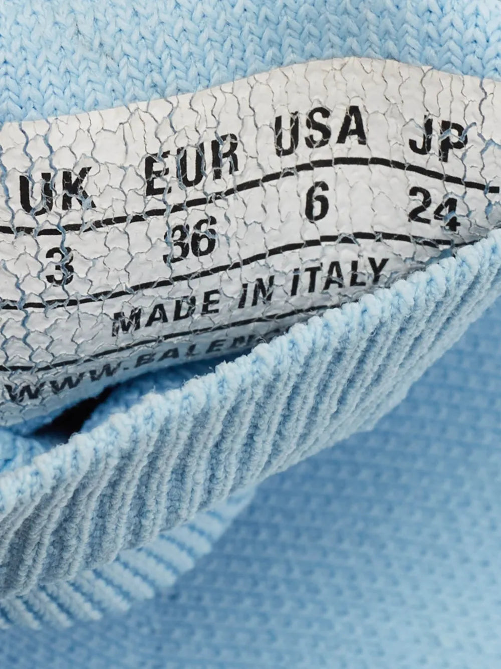 Light blue knit sock sneaker size label showing UK, US, EU, and made in Italy