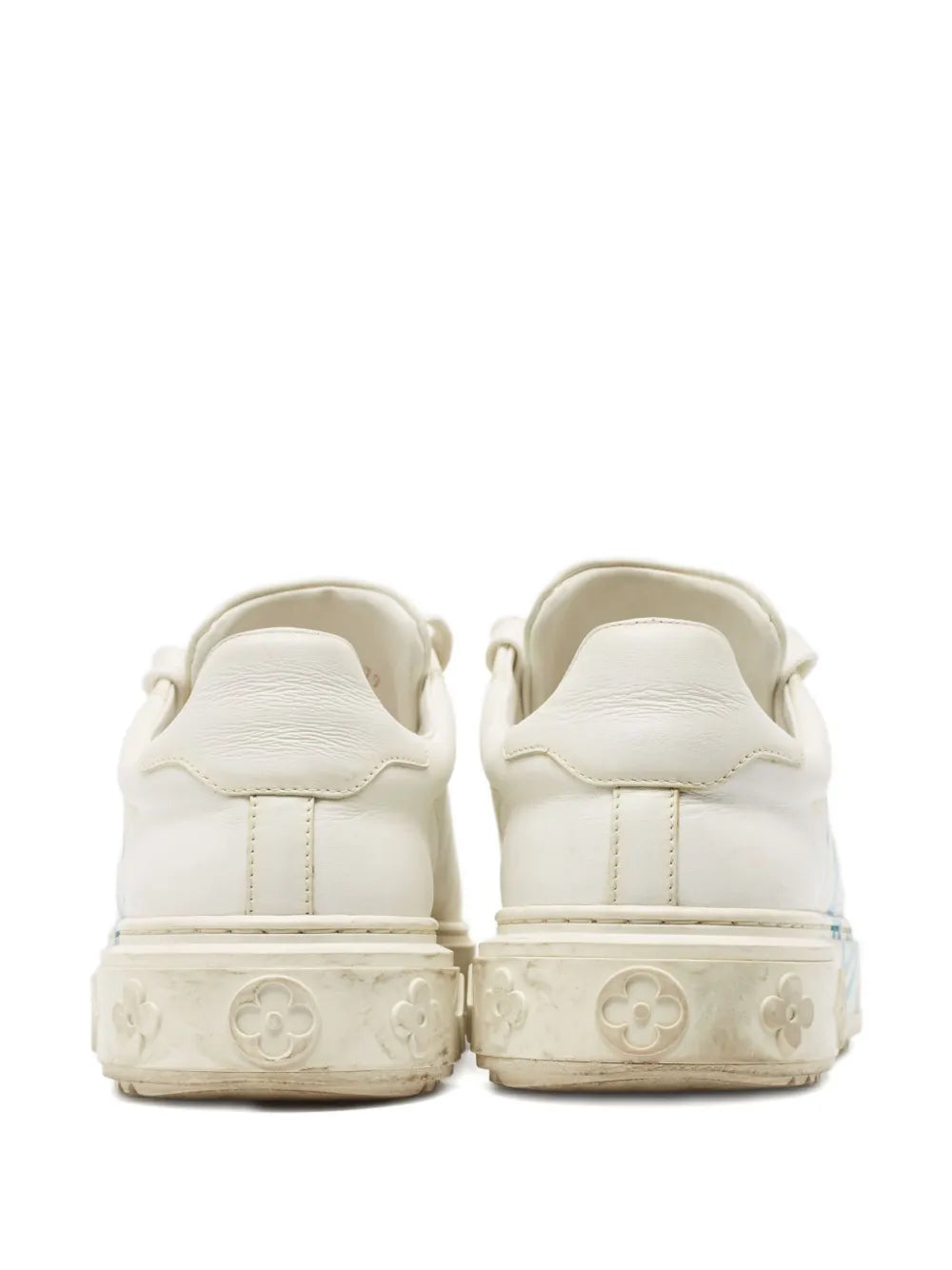 White leather sneakers with stitched back panels and cushioned heel tabs