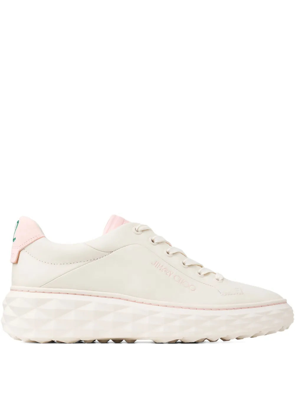 Cream low-top lace-up sneakers with pink heel accents and patterned outsole