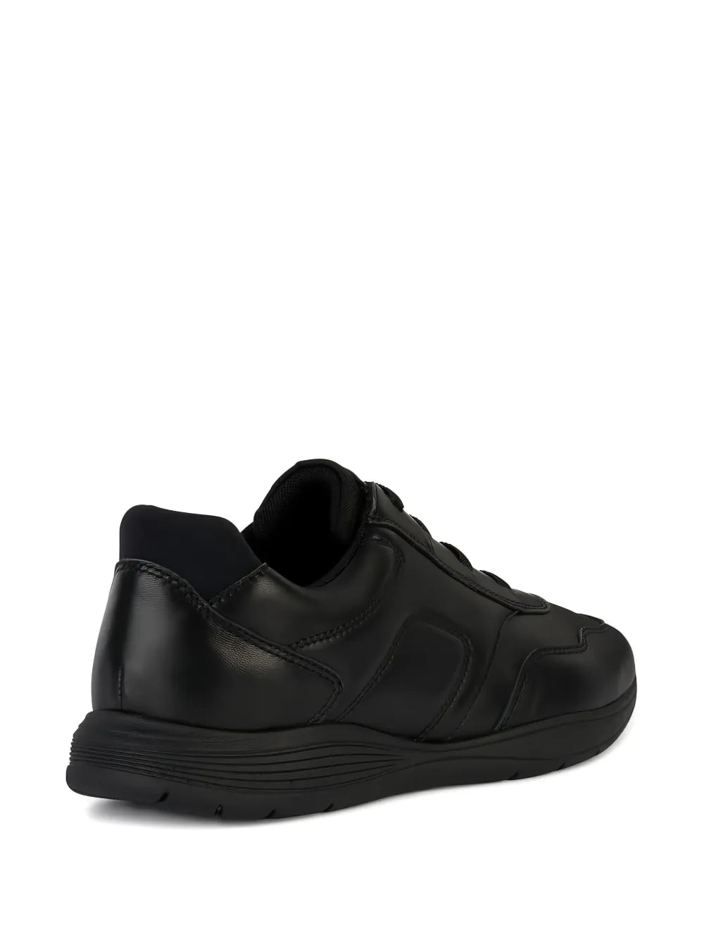 Black low-top sneakers, side profile with lace-up and chunky sole