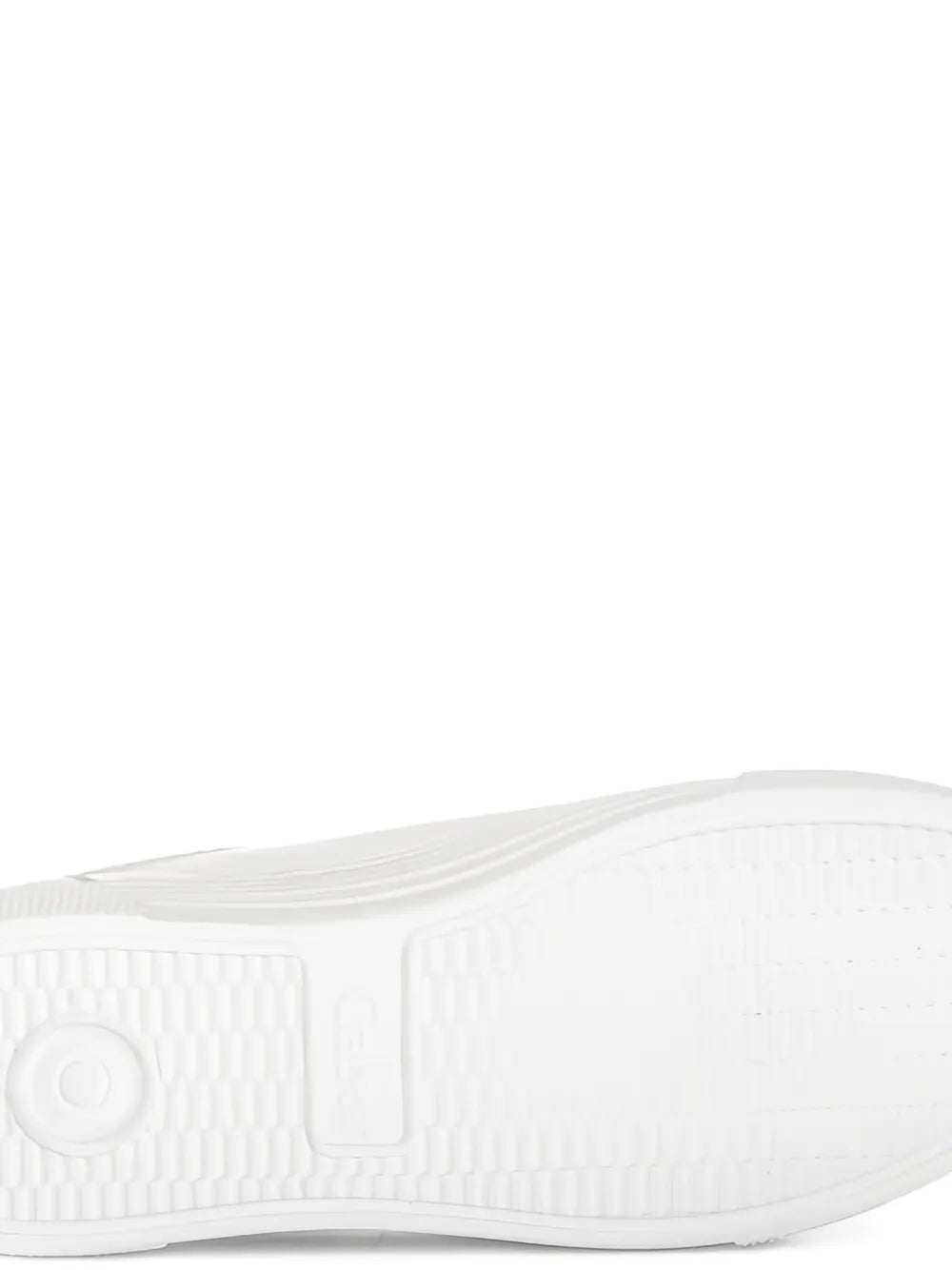 White sneaker outsole with textured tread and ribbed grooves