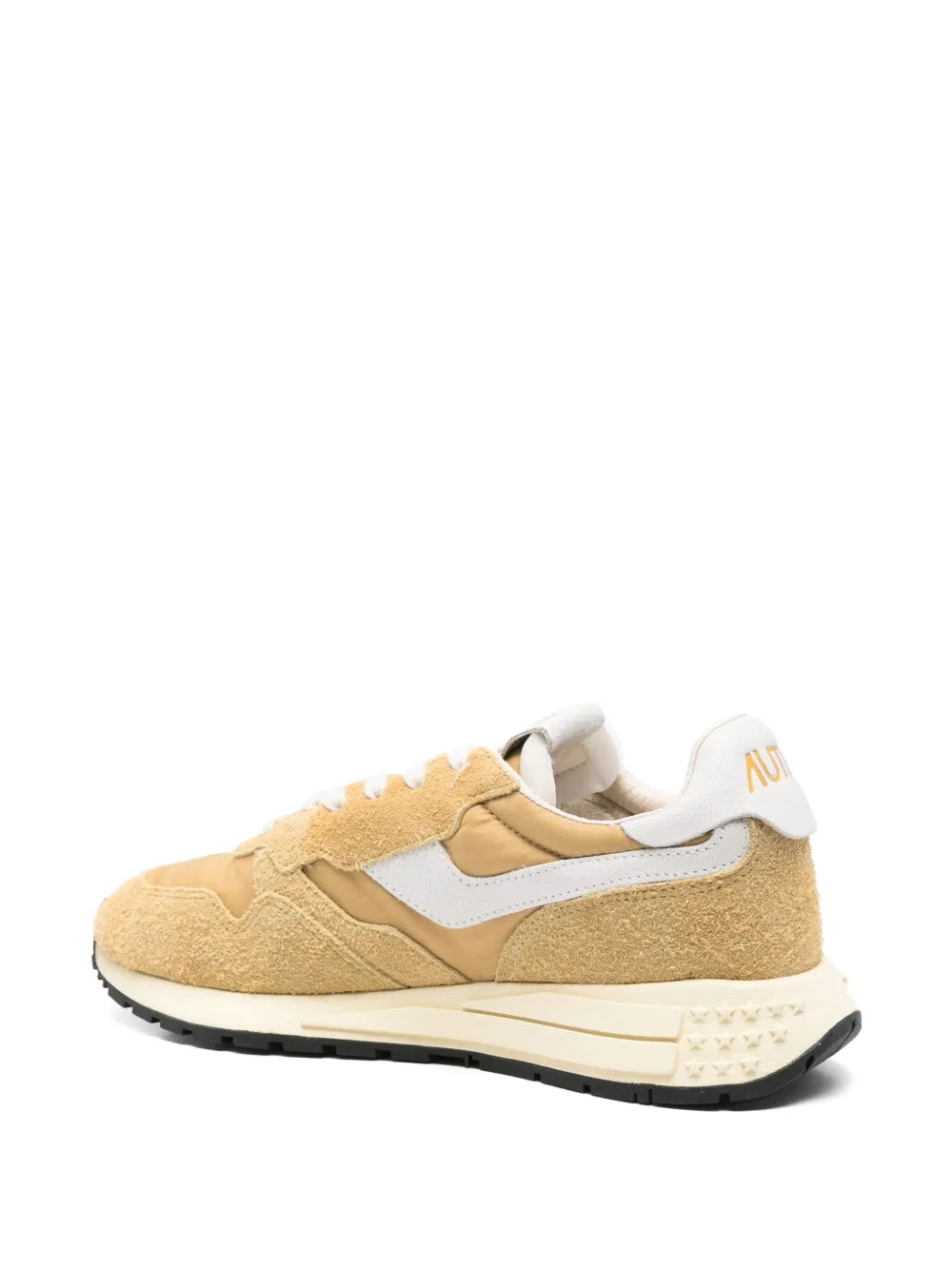 Beige low-top sneakers with white heel panel, lace-up closure and dark sole trim