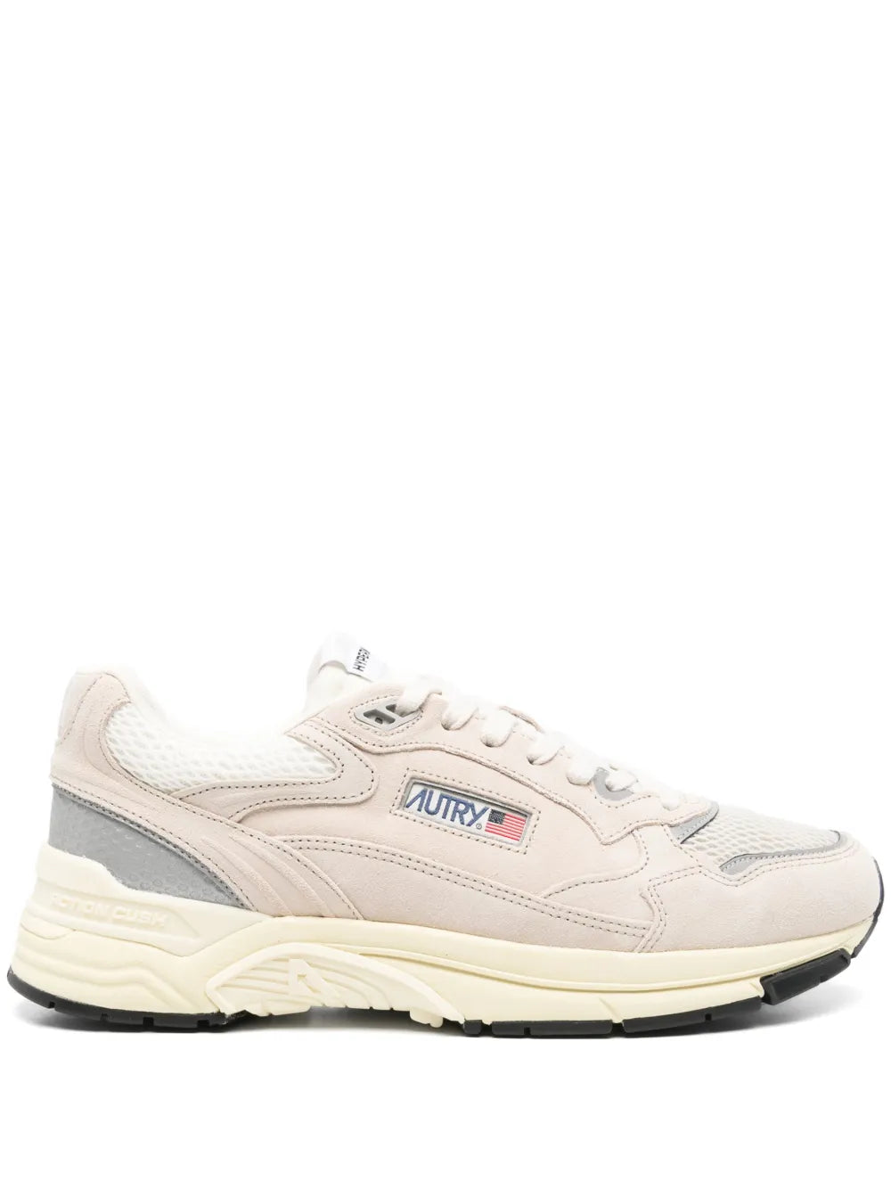 Beige low-top leather sneakers with gray side panel and lace-up closure