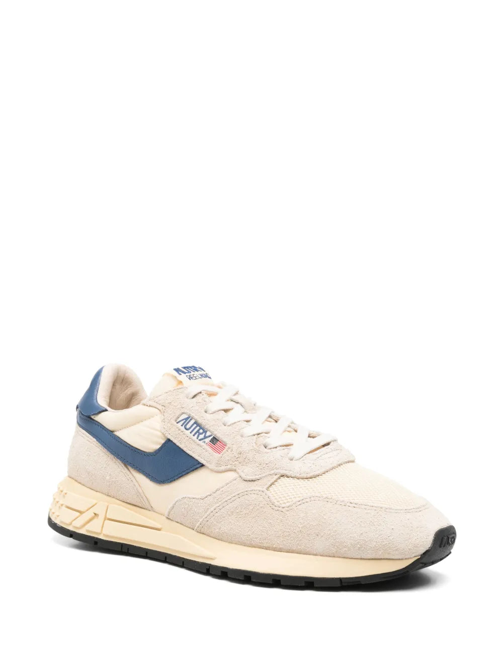 Beige and navy suede low-top sneakers with lace-up front and chunky sole