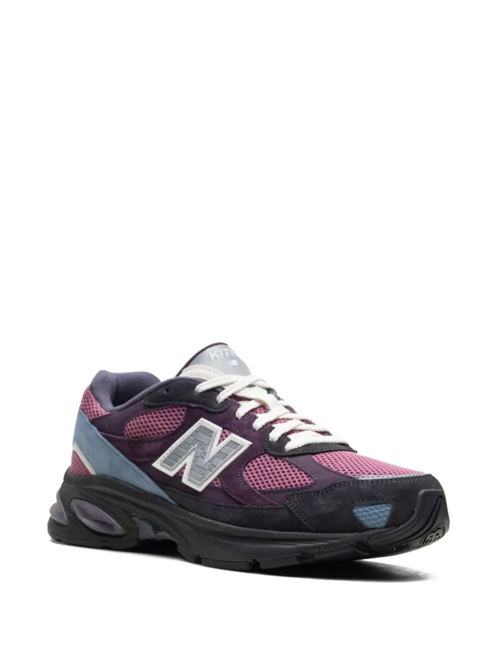 New Balance X Kith 2010 sneaker, side profile in dark purple, black, and blue with laces