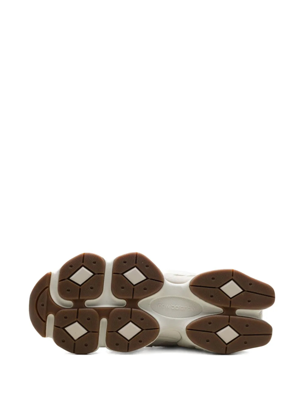 Brown rubber outsole with hex tread for white chunky sneakers