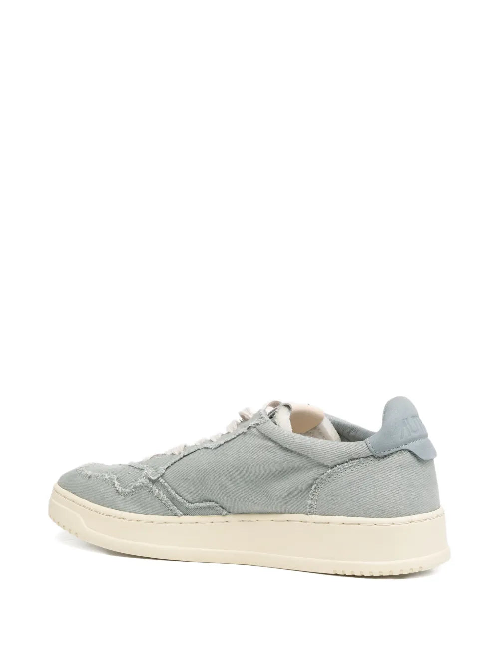 Light blue low-top trainers with cream sole, padded collar, and lace-up front