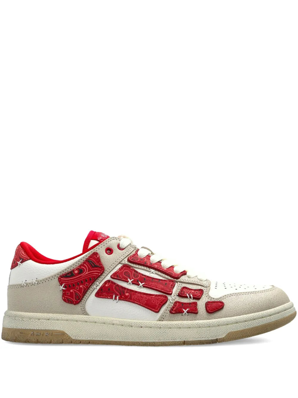 Low-top sneakers with red graphic panels and white laces, light beige sole