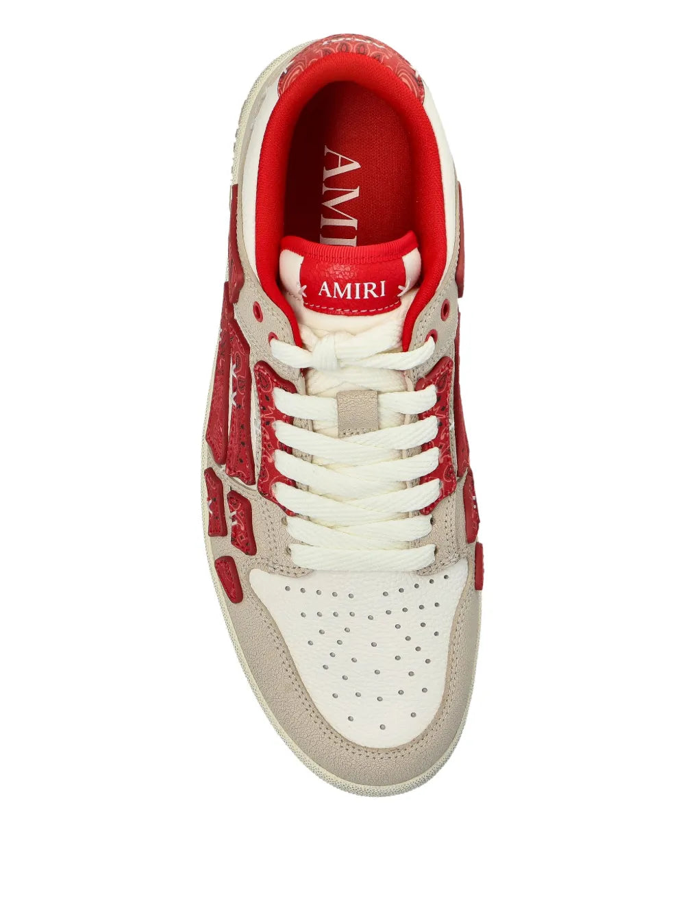 Low-top sneaker, front view, red interior lining and white lace-up upper