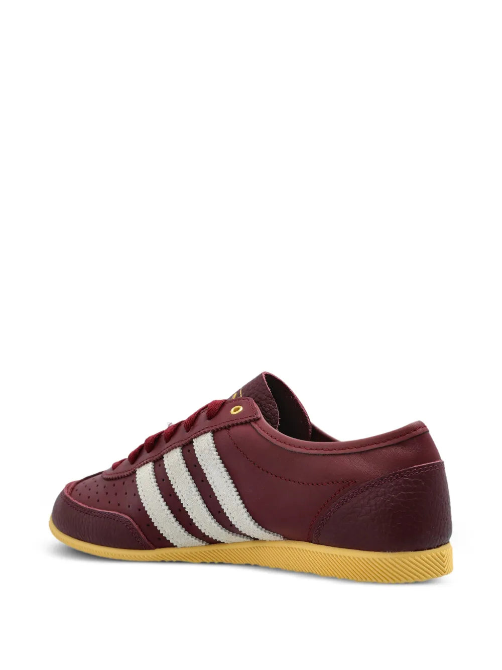Burgundy adidas sneakers with white stripes and gum sole, side and heel view.