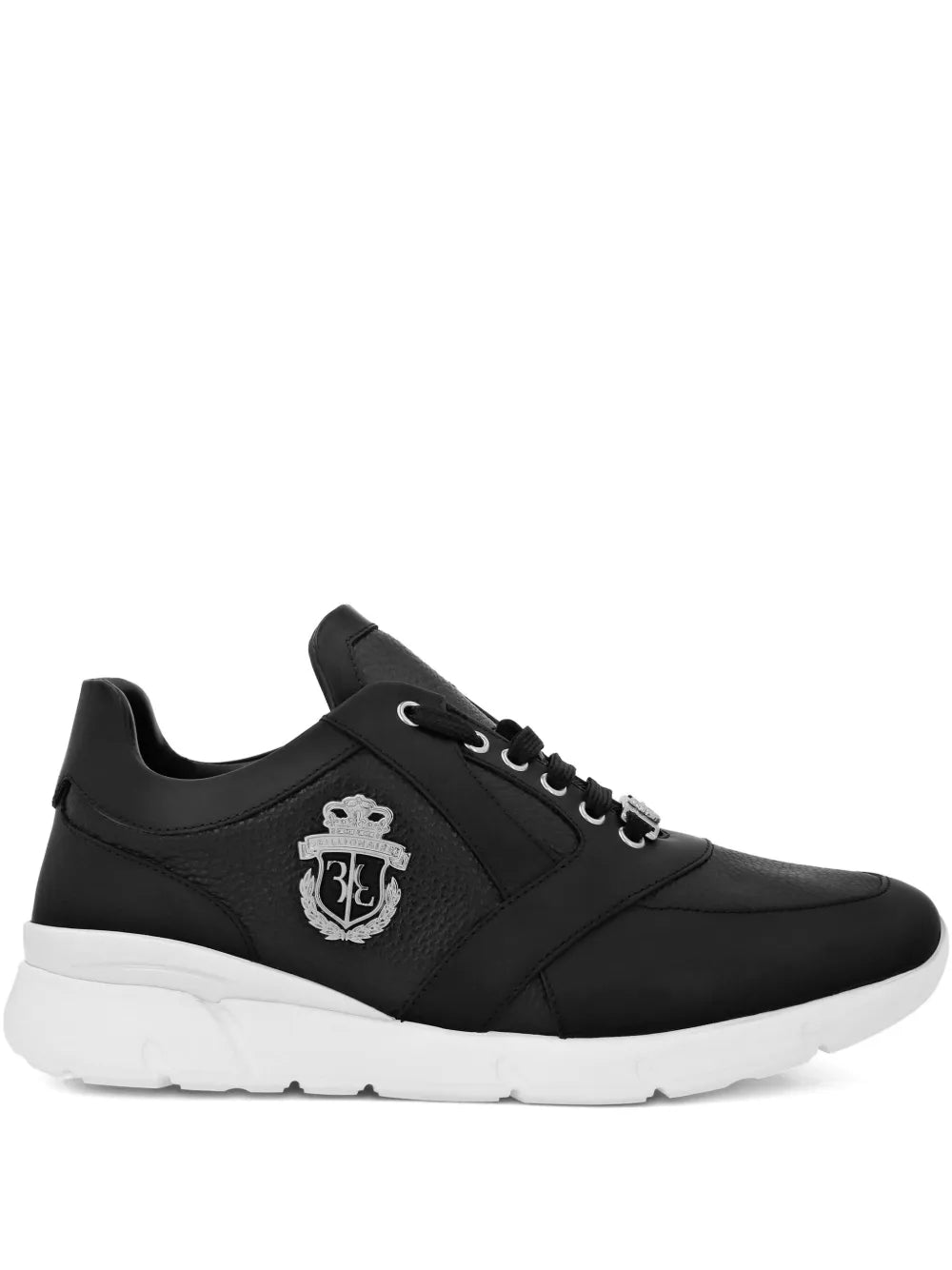 Black runner sneakers with crest logo, lace-up front, and white cushioned sole