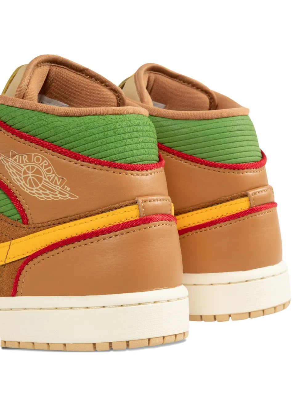 Beige Air Jordan high-top sneakers with green collar, red stripe, and yellow side panel