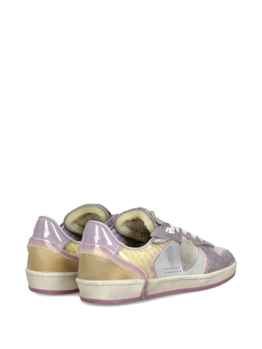 Back view of low-top sneakers with purple heel collar and beige underlay trim