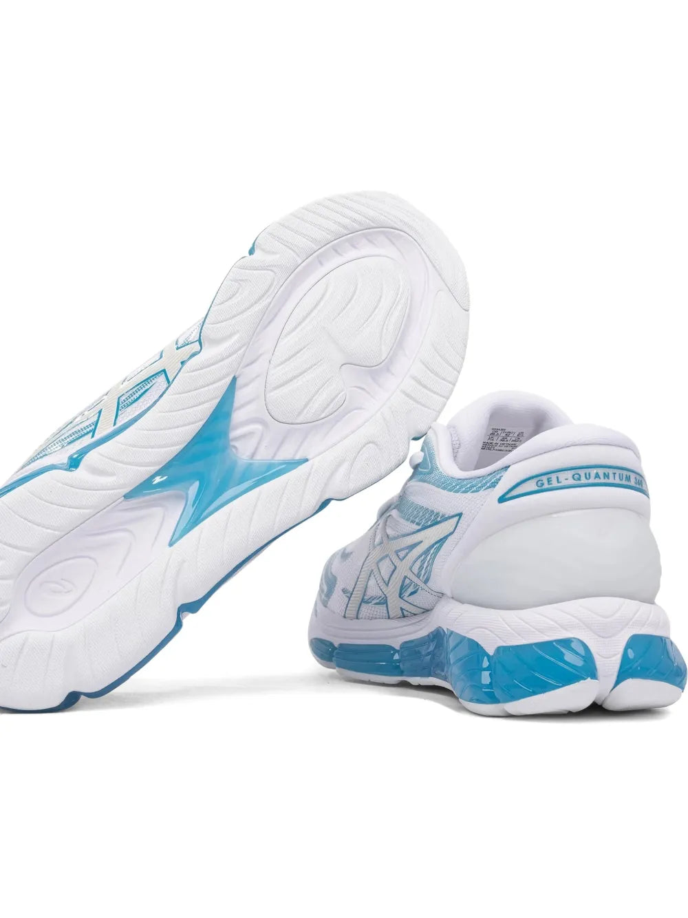Asics white sneakers with blue heel, angled outsole tread view