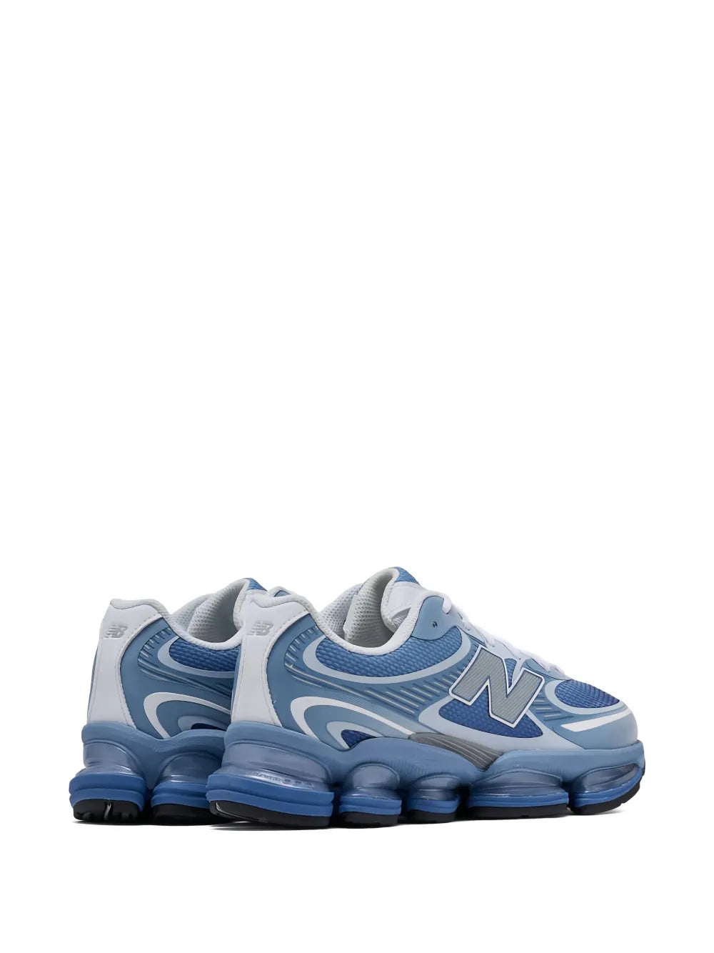 Light blue and white New Balance sneakers, front three-quarter with lace closure