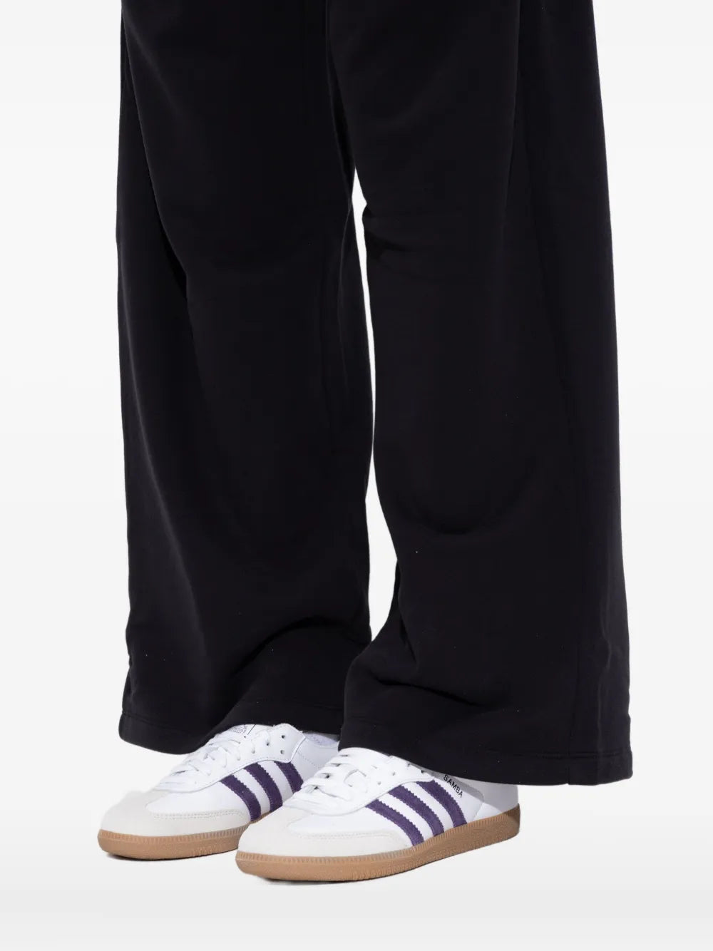 White and purple leather sneaker with purple stripes and gum sole