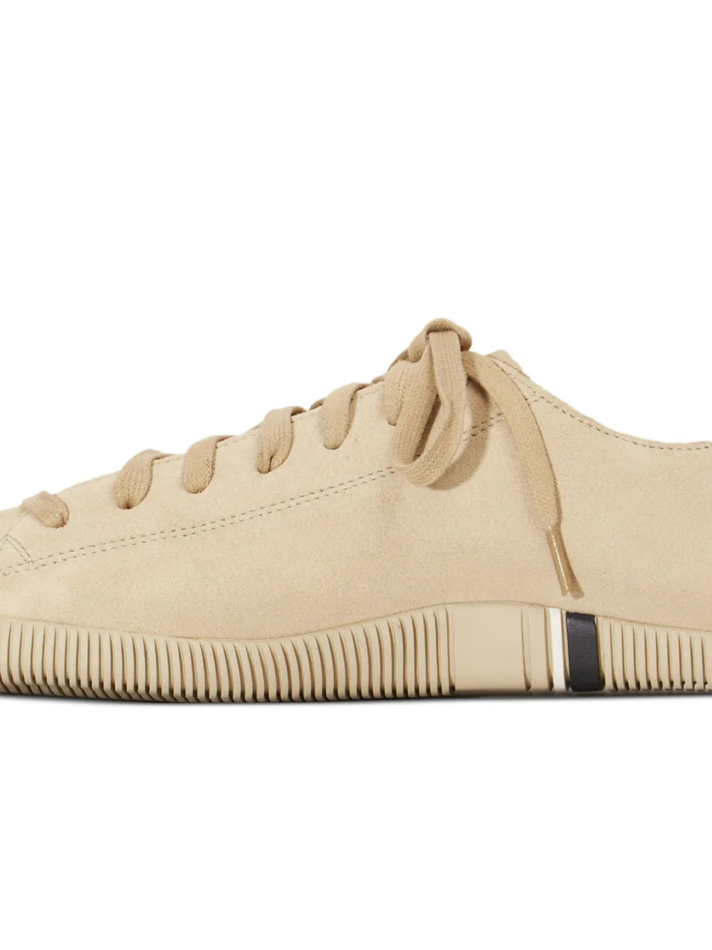 Beige suede lace-up sneakers side profile with rubber bumper and stripe detail
