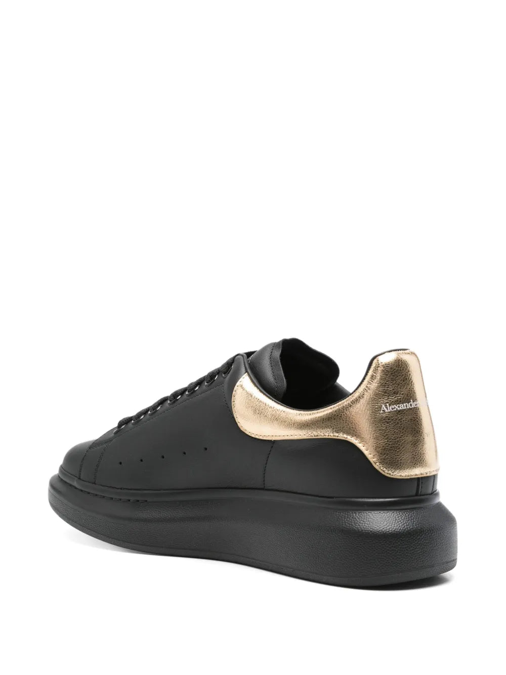 Black leather sneaker with gold heel patch and Alexander Mcqueen logo on back
