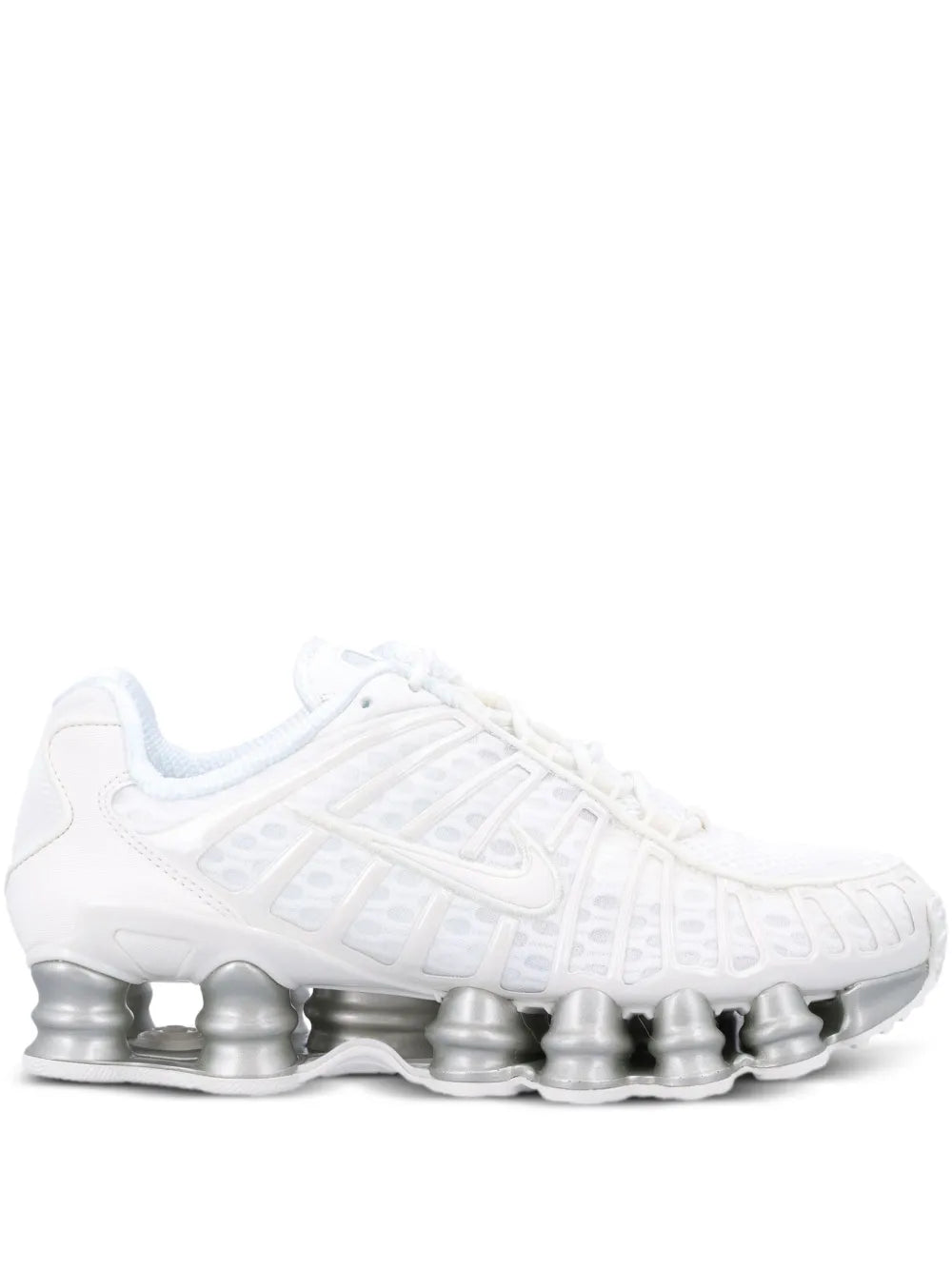 White lace-up athletic sneaker with ribbed upper and silver Shox pod sole