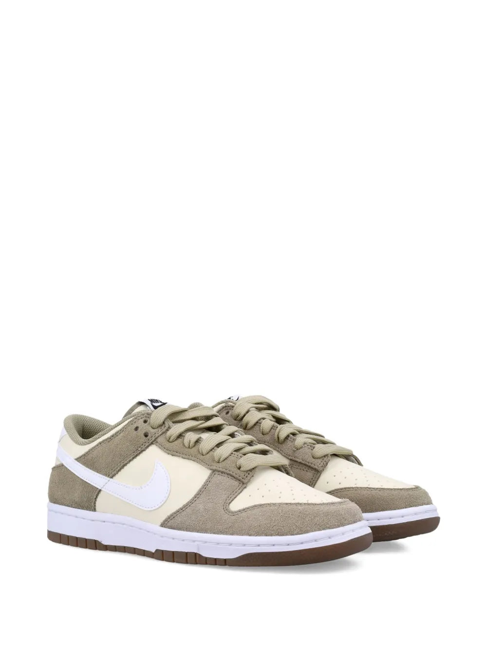 Low-top lace-up sneakers with beige suede panels, white swoosh, and dark outsole