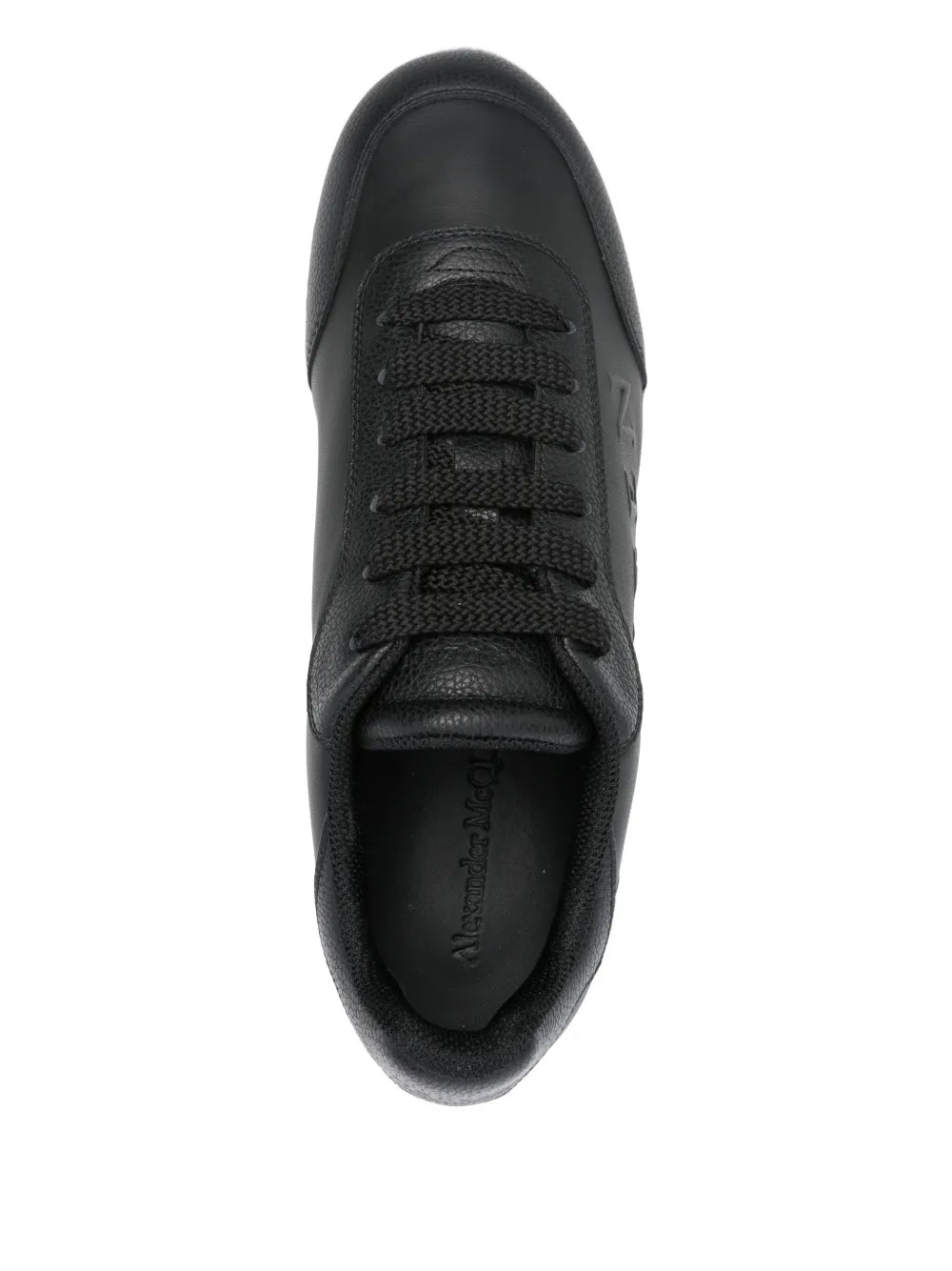 Black lace-up platform sneaker, top view of laces and padded collar, white edge