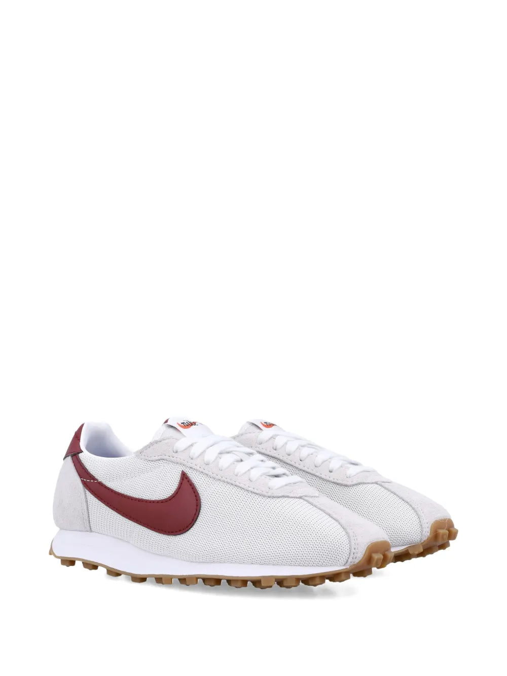 White low-top sneaker with burgundy Swoosh, perforated upper, tan outsole