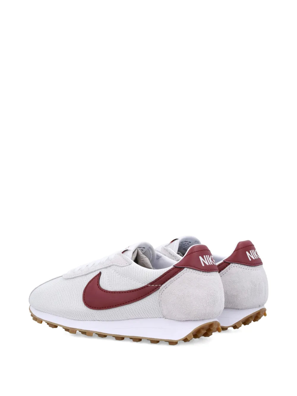 White low-top sneaker showing heel pull and burgundy Swoosh, tan outsole