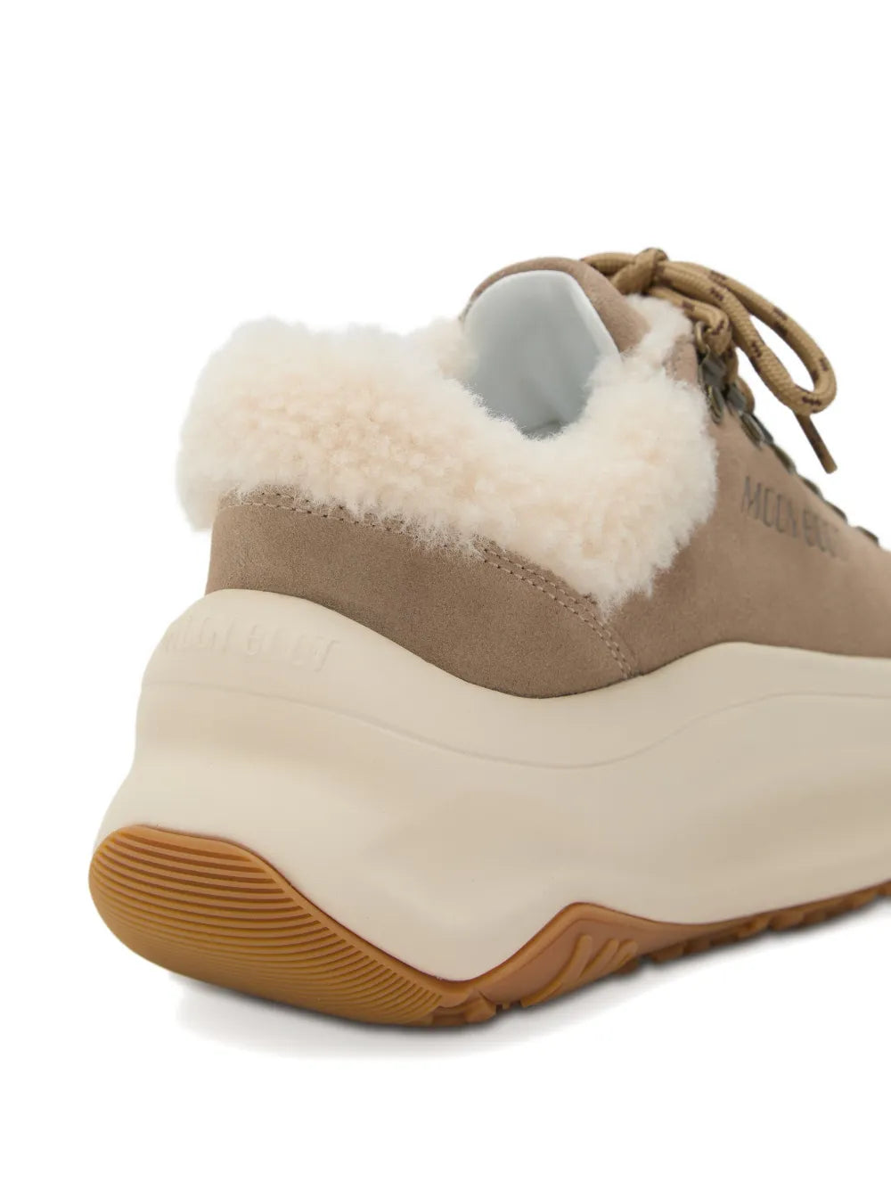 Beige shearling-lined platform boot with lace eyelets and ribbed tread sole