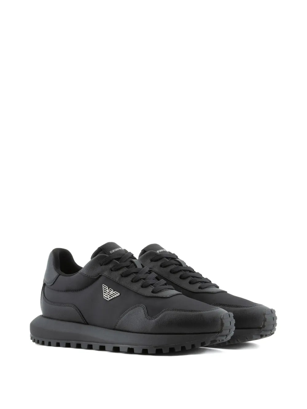 Black lace-up sneakers with side logo emblem and treaded rubber sole.