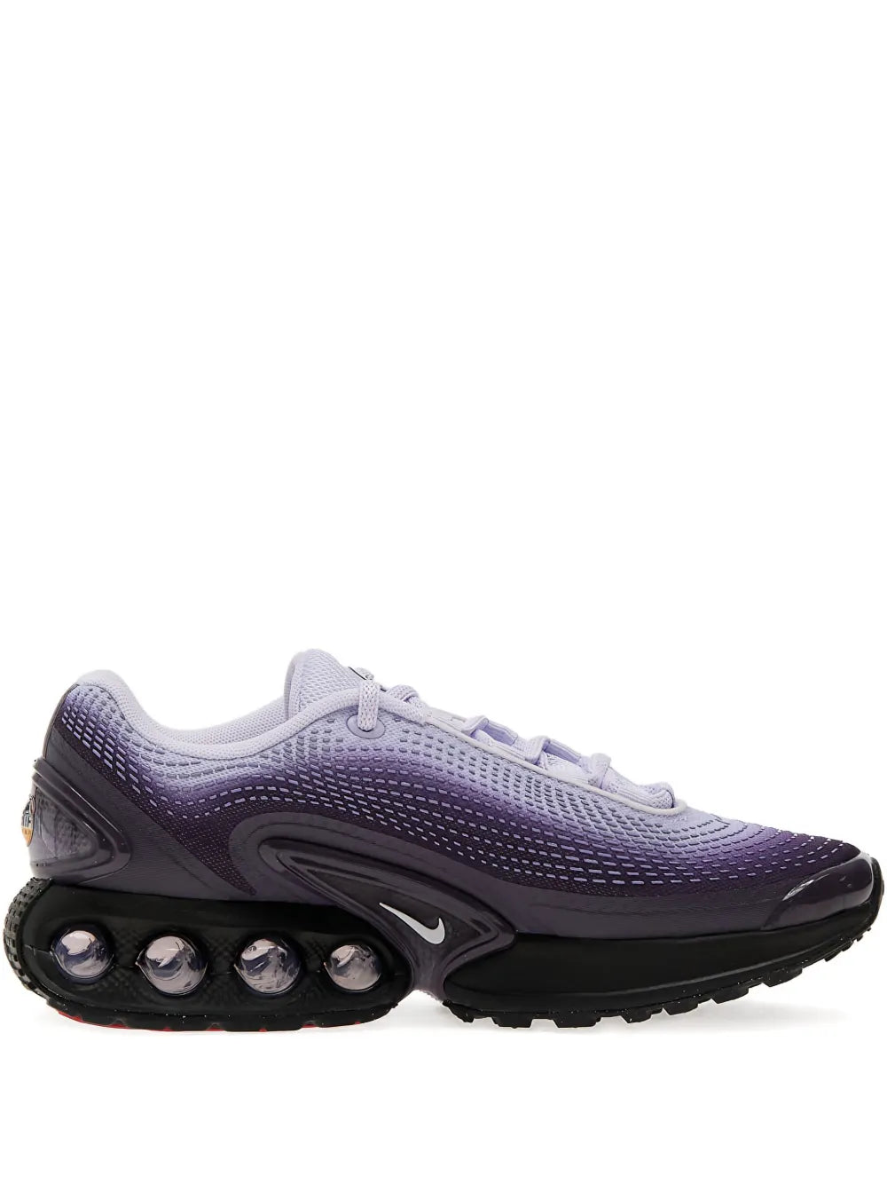 Nike Air Max Dn sneakers in dark purple with black accents and visible Air pods