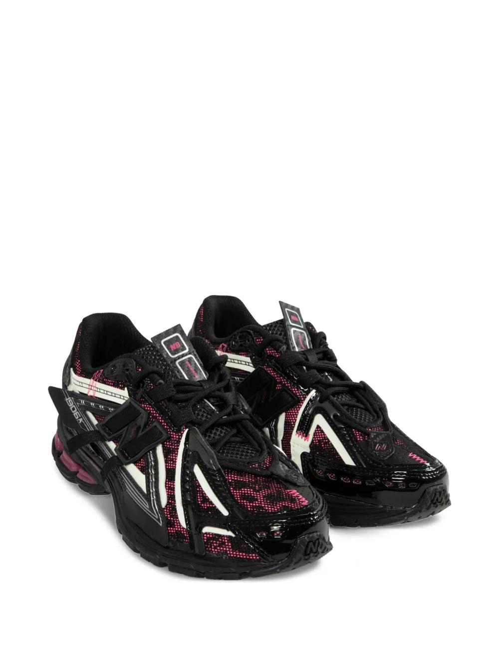 Black lace-up running shoes, two shoes front view with red and white accents