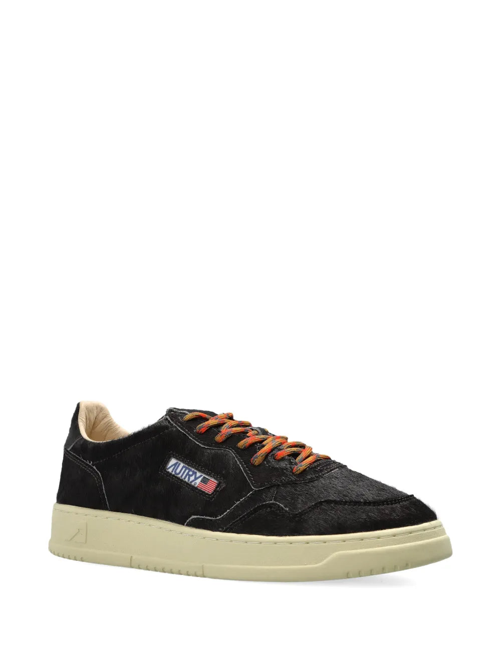 Black suede low-top sneakers with side logo and orange lace-up, cream sole