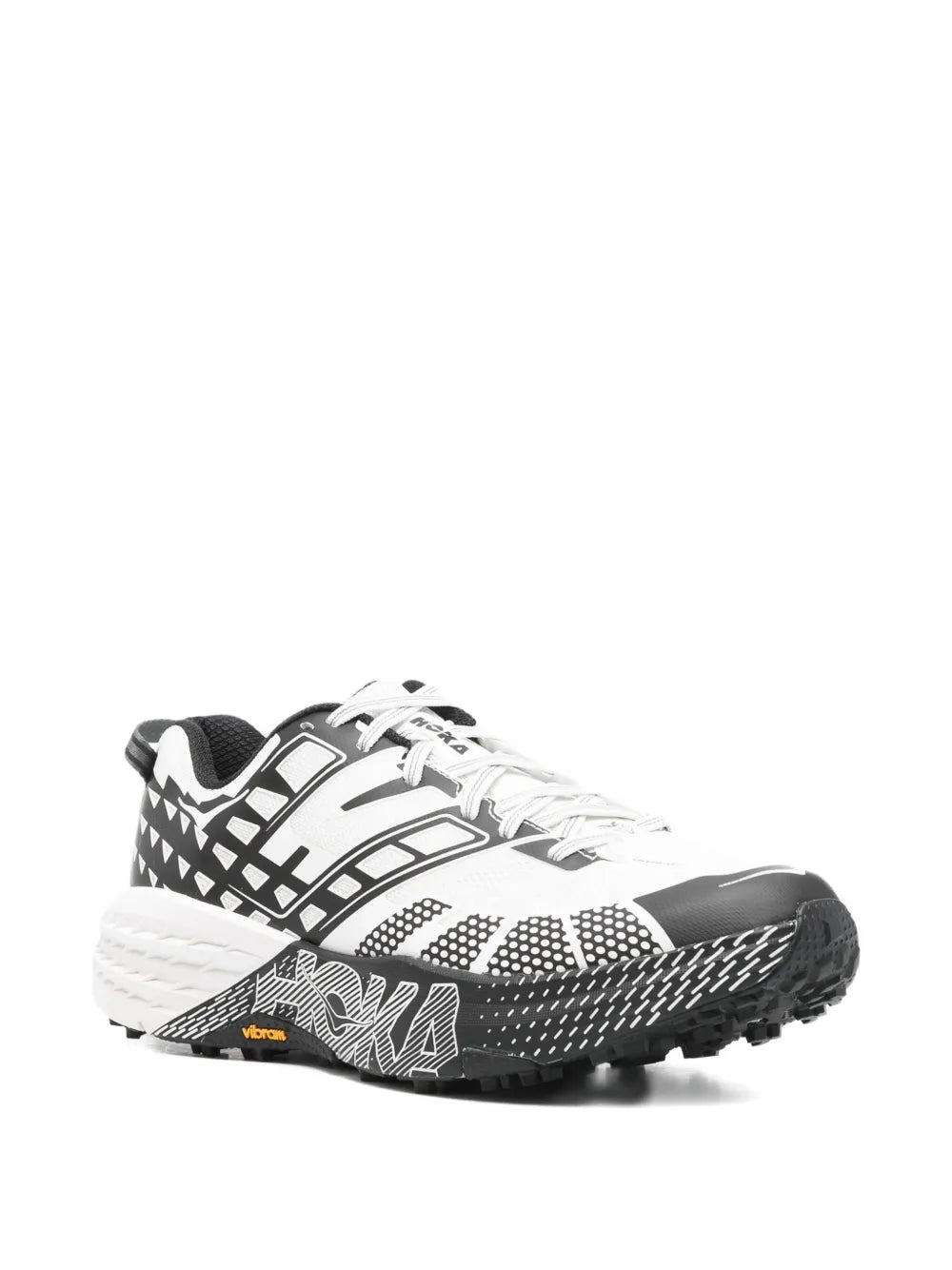 White and black geometric lace-up HOKA sneakers with grippy black outsole