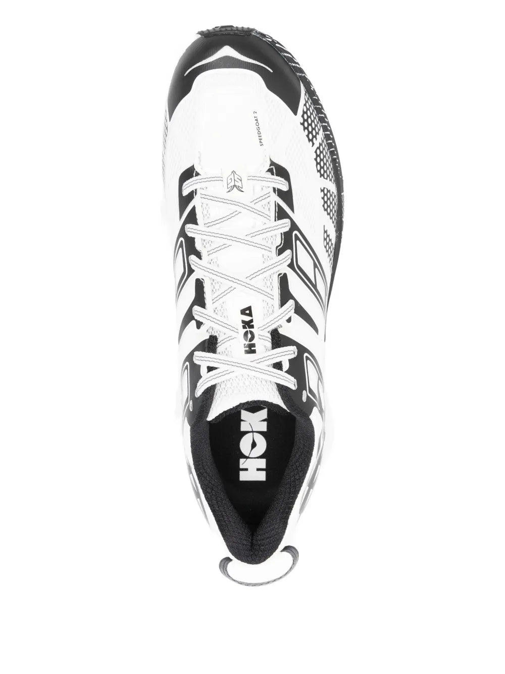 White and black geometric HOKA sneakers viewed from top, lace-up with padded collar