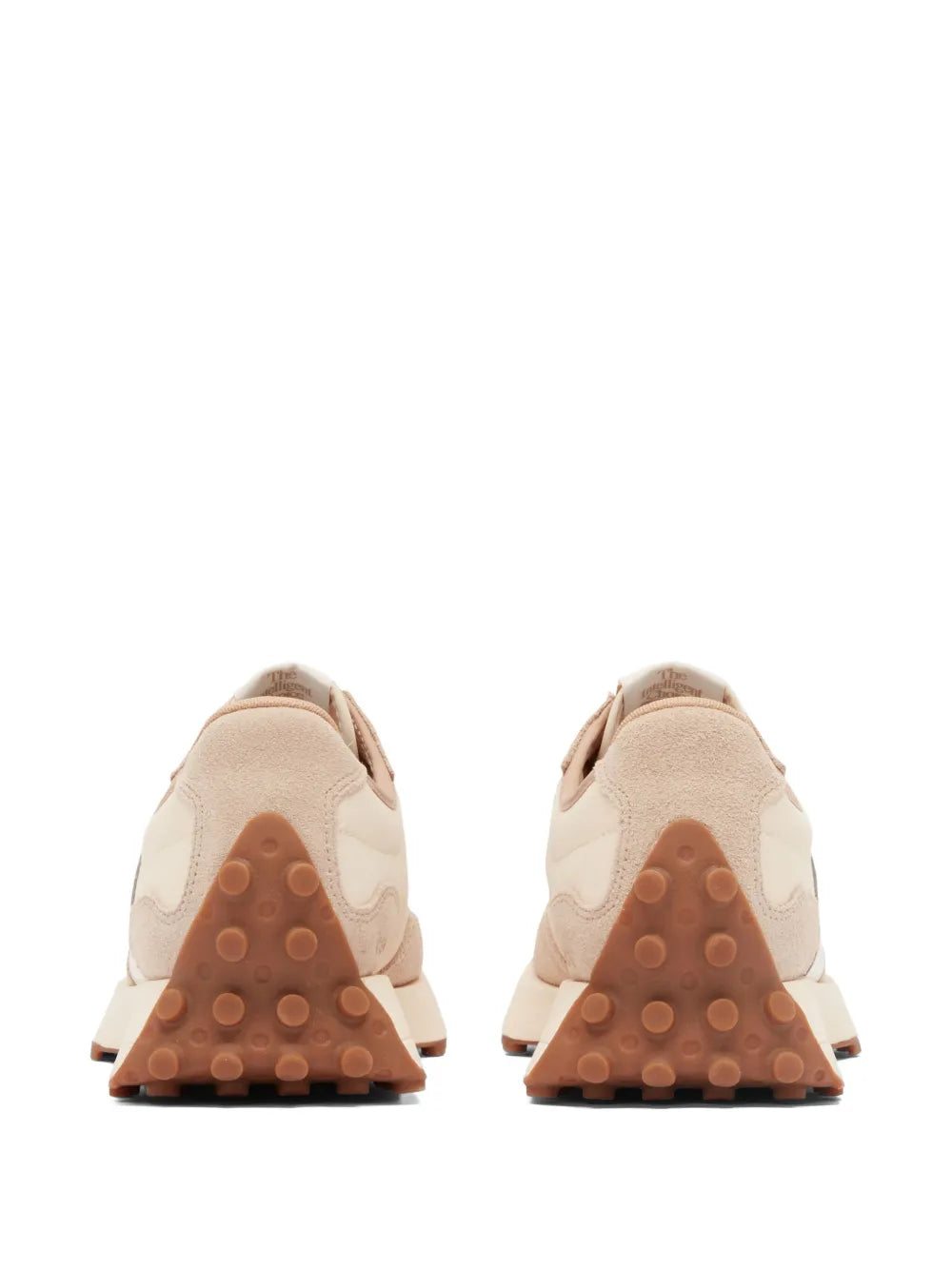 Light beige sneakers with textured rubber outsole and sculpted heel
