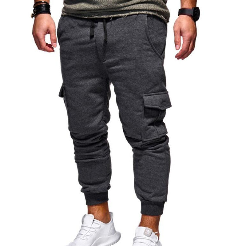 Men’s cargo sweatpants in dark gray, drawstring waistband, cargo pockets, cuffed jogger legs.