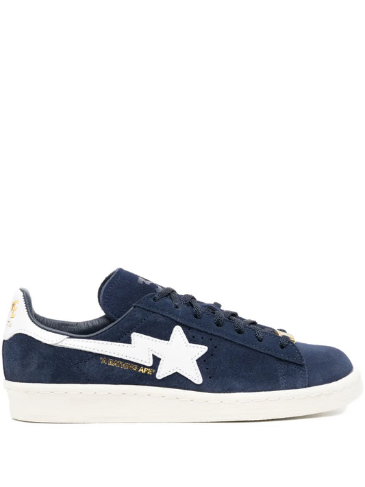 Blue suede lace-up sneaker with white star patch and off-white rubber sole