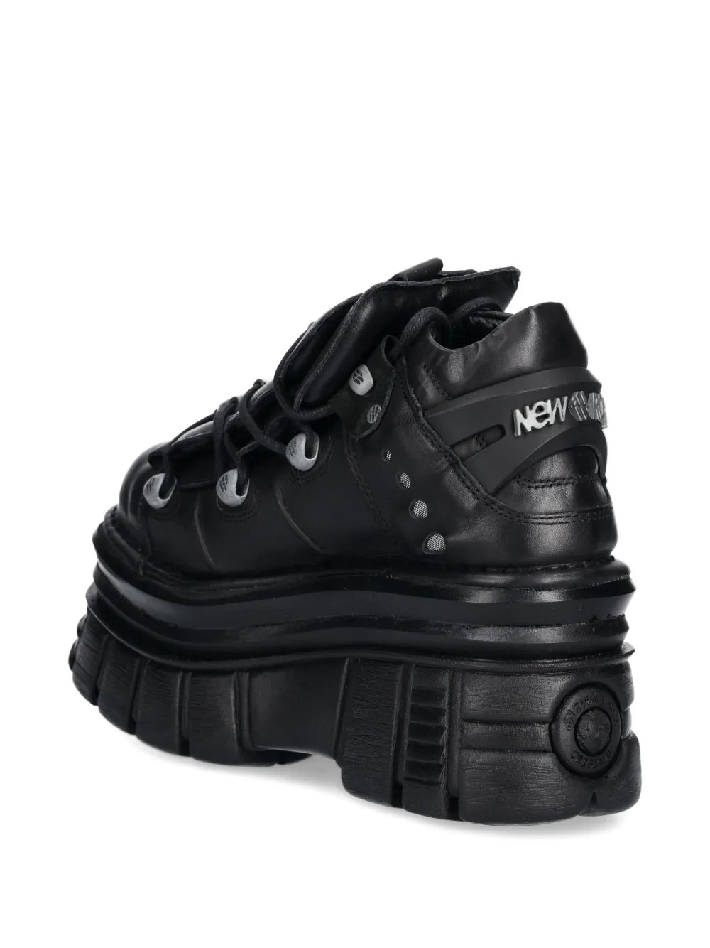 Black platform lace-up trainers, rear view with New Rock logo label.