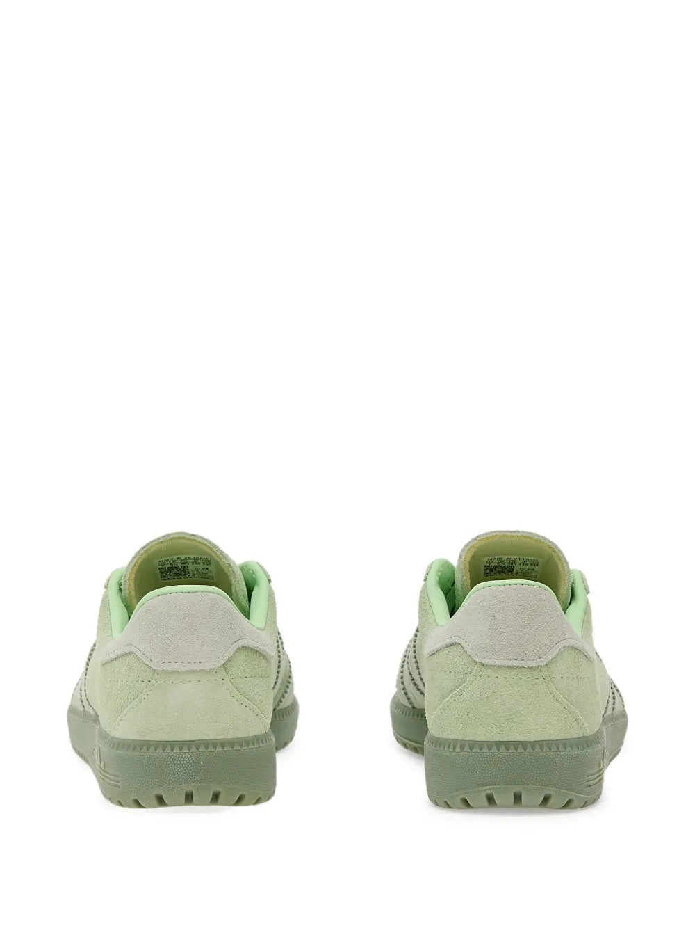 Back view of green low-top sneakers with heel tab and cushioned collar.